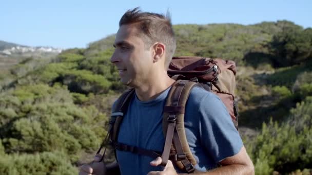 Happy middle aged man wearing camping backpack - Footage, Video