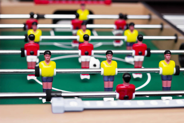 Details of a table soccer game. Table football is a toy for children. Close up. Selective focus - Valokuva, kuva