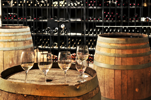 Wine glasses and barrels - Photo, Image