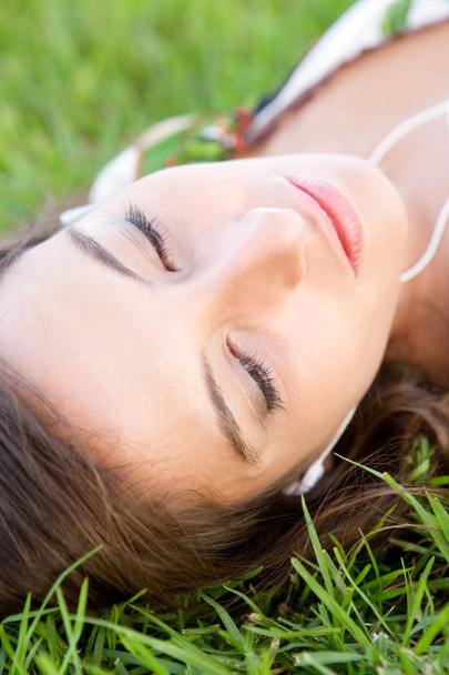 Woman laying on grass - Fotó, kép