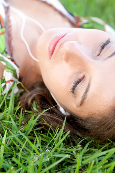 Woman laying on grass - Photo, Image