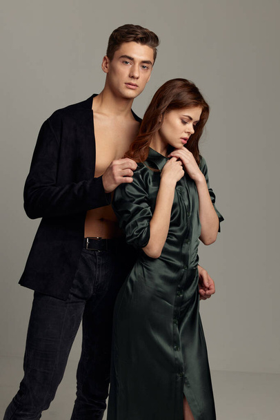 man and woman stand side by side luxury romance moda Studio elegant style - Fotoğraf, Görsel