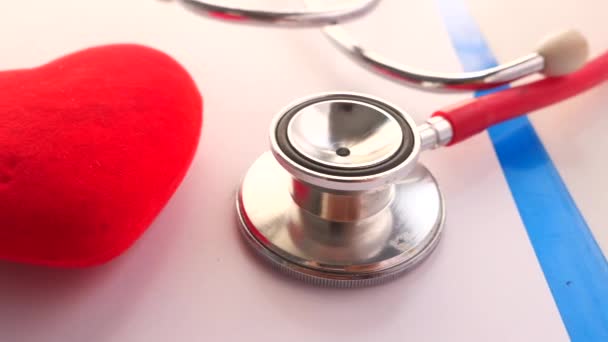 heart shape symbol and stethoscope on white background  - Footage, Video