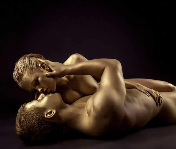 Naked lovers posing as golden statues come to life - Фото, изображение