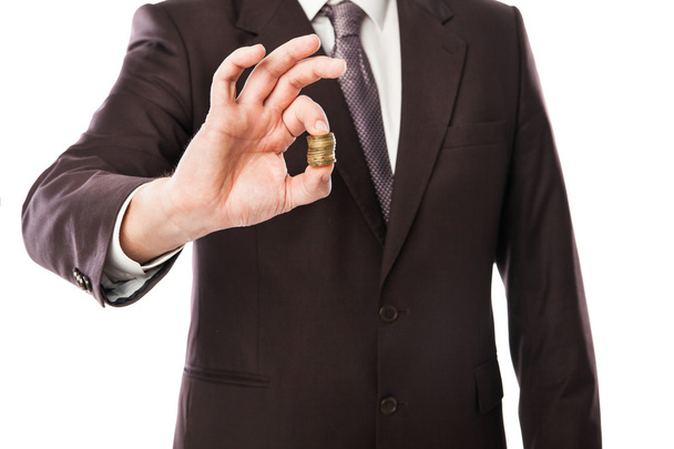 Businessman holding coins in his hand isolated - Foto, immagini