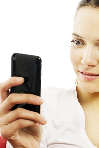 Young woman with smart phone on white background studio - Zdjęcie, obraz