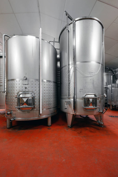 Steel barrels for fermentation of wine in winemaker factory - Photo, Image