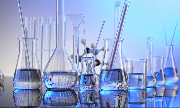 Concepto de laboratorio de fondo. Tubos y vasos de vidrio sobre fondo azul. - Foto, imagen