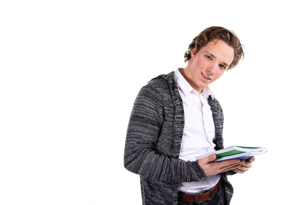 Student on a white background. Young attractive guy and books. - Foto, imagen