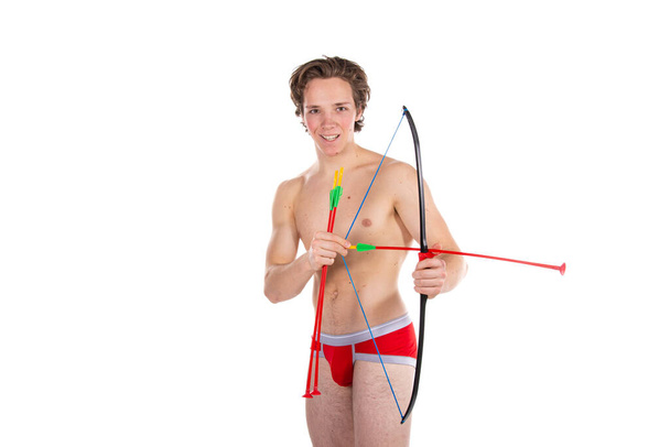 Love and romance. Funny sexy cupid. Handsome guy on a white background. - Photo, Image