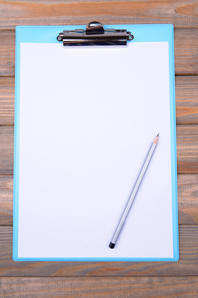Clipboard on wooden background - Photo, image