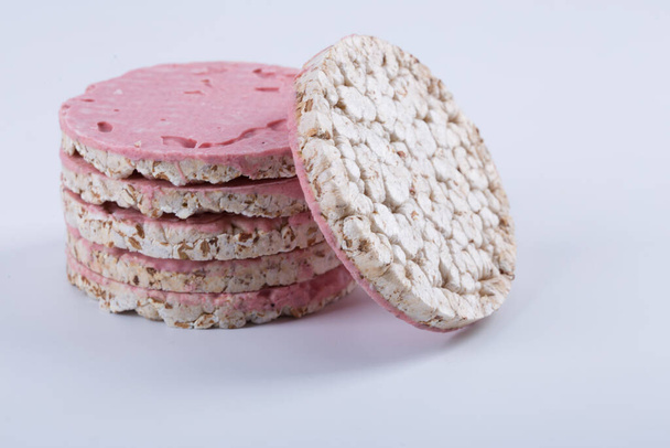 A pink flat round galettes on white background. - Photo, Image