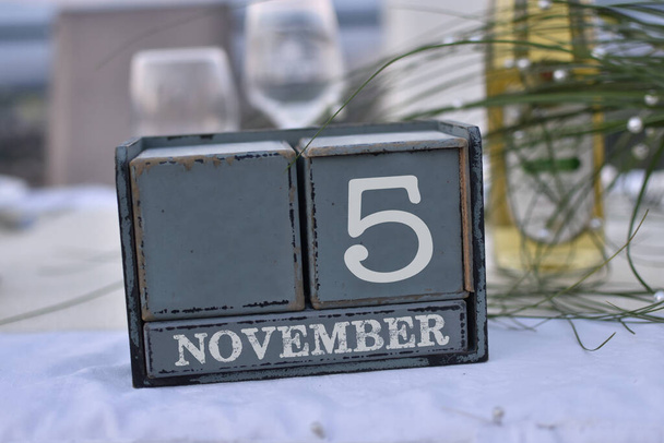 Wood blocks in box with date, day and month 5 November. Wooden blocks calendar - Photo, Image