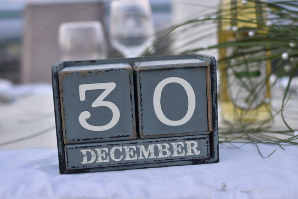 Wood blocks in box with date, day and month 30 December. Wooden blocks calendar - Photo, Image