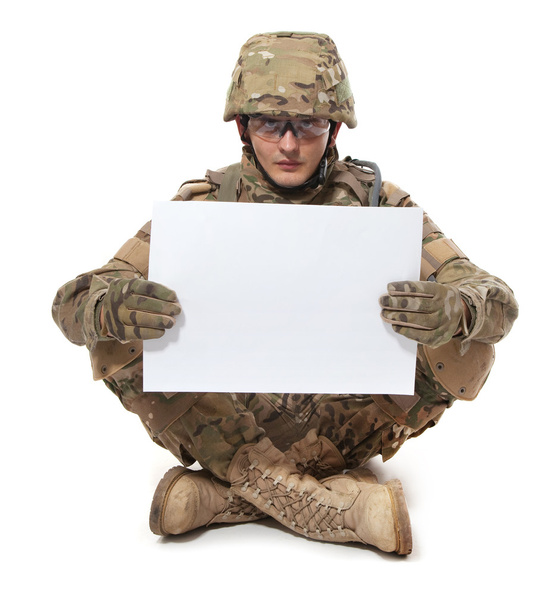 Modern soldier holding a poster - Zdjęcie, obraz