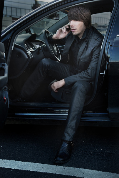 Elegant man in a car, calling - Foto, Imagen