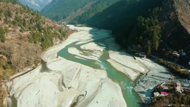 Aerial View of Bhagirathi River surrounded by Shape of Sands,Apple orchards,Houses,Green Forest and Brown Mountains, located in beautiful city of Harsil, Uttarkashi, Uttarakhand. Himalayan River Ganges.  - Footage, Video