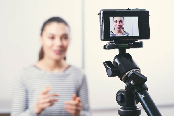 Young female blogger on camera screen - Photo, Image