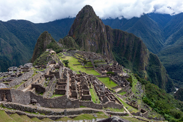 The Inca city of Machu Picchu in Peru, South America. Although known locally, it was not known to the Spanish during the colonial period and was unknown to the outside world until American historian Hiram Bingham brought it to international attention - Photo, Image
