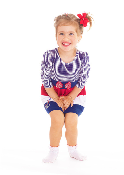 Charming little girl posing in studio. - Foto, afbeelding