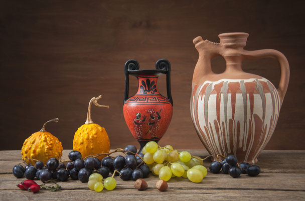 Grapes and pumpkins with ceramic jugs - Photo, Image