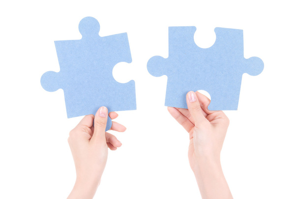 puzzle pieces in woman hands isolated on white - Valokuva, kuva