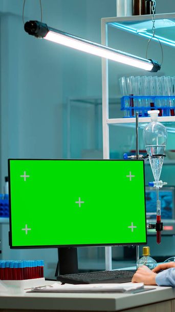 Research scientist has conversation with man typing on green screen pc - Photo, Image