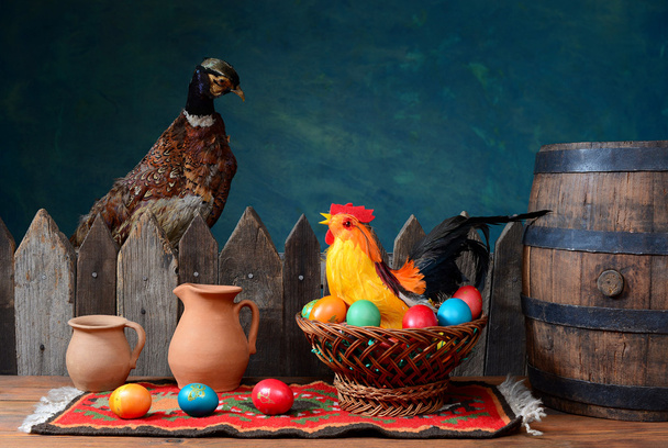 Stuffed pheasant and rooster with colored eggs - Photo, Image