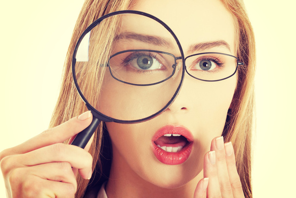 Business woman with magnifying glass. - Photo, image