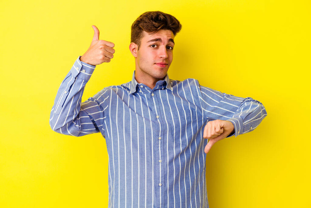 Young caucasian man posing on color background  - Fotó, kép