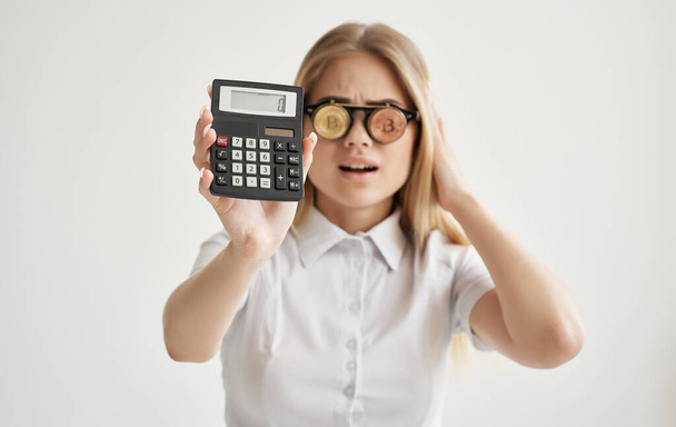 cheerful woman glasses in the form of cryptocurrency Bitcoin calculator financial money - Fotografie, Obrázek