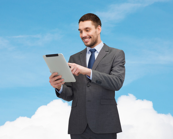 Smiling businessman with tablet pc computer - Photo, image