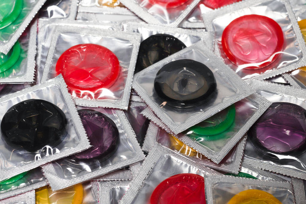 Colorful condoms background. Top view.  - Photo, Image