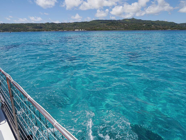 View of Saipan's clear blue waters and the coastal areas from the deck of a ferry boat - Photo, Image