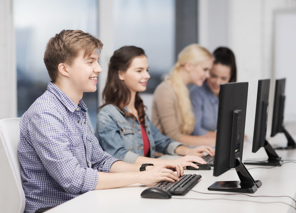 Students looking at computer monitor at school - Photo, Image