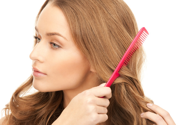 Beautiful woman with comb - Foto, afbeelding