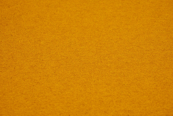 Textuur van een geel katoenen doek als achtergrond. Kopieerruimte. - Foto, afbeelding