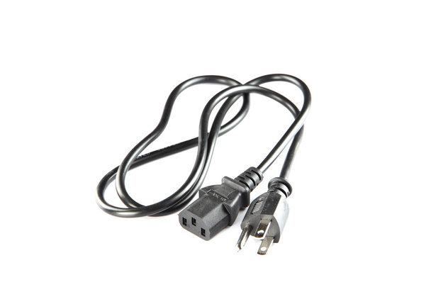 Black power kabel van plug- and -socket geïsoleerd. - Foto, afbeelding