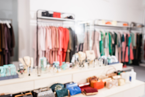Blurred background of accessories in showroom with clothes  - Photo, Image