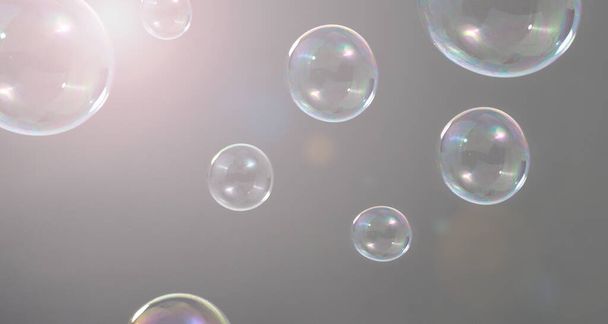 Burbujas de champú flotando como volando en el aire por el viento que representan refrescantes momentos alegres juguetones y suaves suaves y cómodos y se ven húmedos jabón para la industria de productos de detergente de higiene. - Foto, imagen