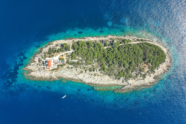 Aerial overhead drone shot of Host Island in Adriatic sea near Vis Island in Croatia summer - Photo, Image