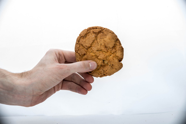 Deliciosos biscoitos saborosos isolados em branco
 - Foto, Imagem