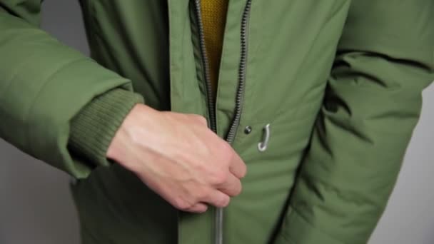 Beautiful women closing winter jacket with zipper. - Footage, Video