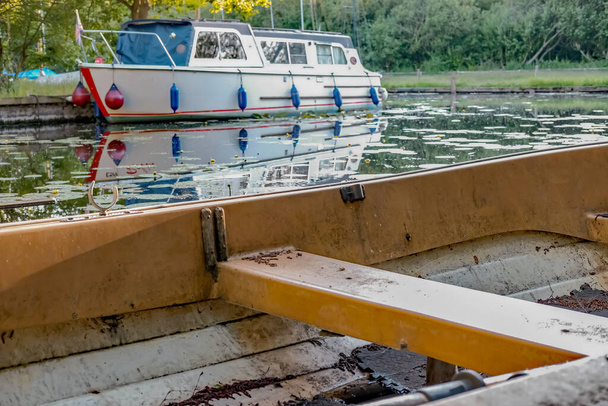 Small rowing boat moored in a small staithe on the River Ant in the heart of the Norfolk Broads - Photo, Image