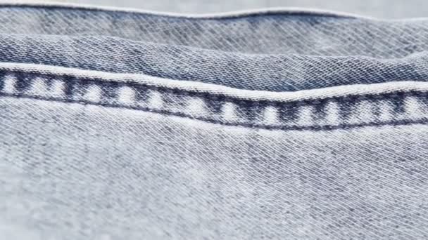 Blue Jeans Textur Hintergrund. Kamera Bewegung Schieberegler selektiver Fokus - Filmmaterial, Video
