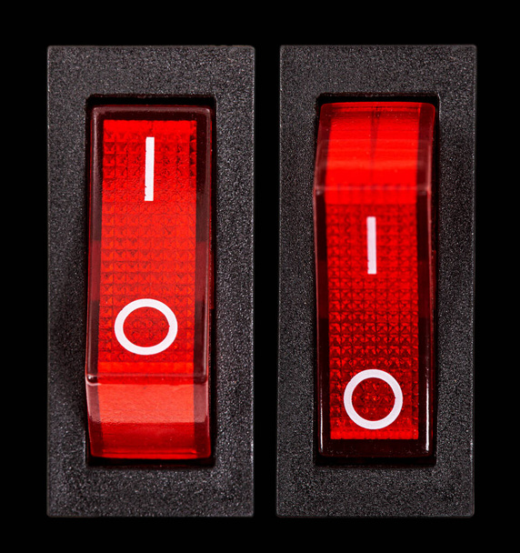 Interrupteurs d'alimentation rouge en position ON et OF, isolés sur fond noir - Photo, image