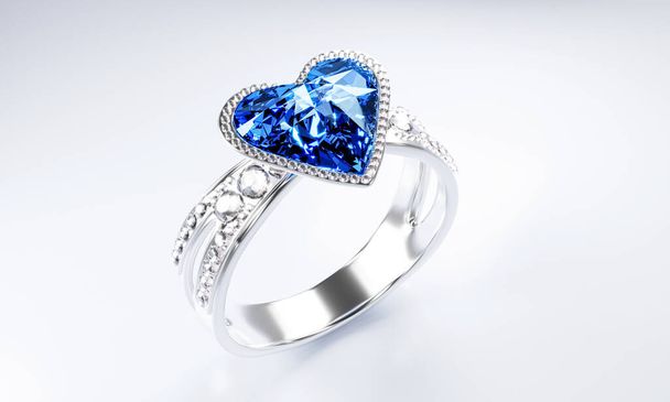 Duży niebieski diamentowy kształt serca otoczony jest wieloma diamentami na pierścieniu z platynowego złota umieszczonego na szarym tle. Elegancka obrączka z diamentem dla kobiet. 3d renderowanie - Zdjęcie, obraz