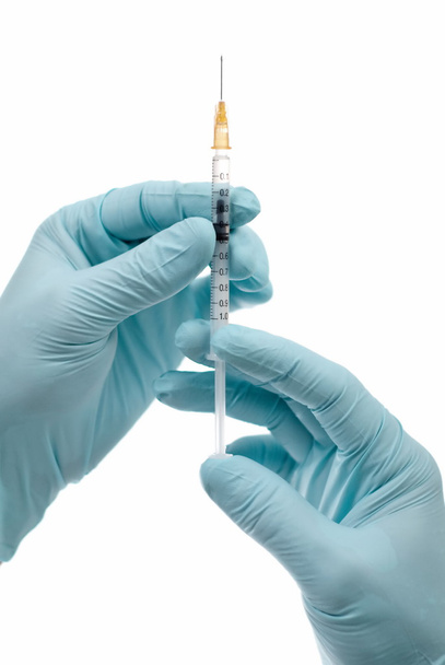 Syringe in hands. - Фото, зображення