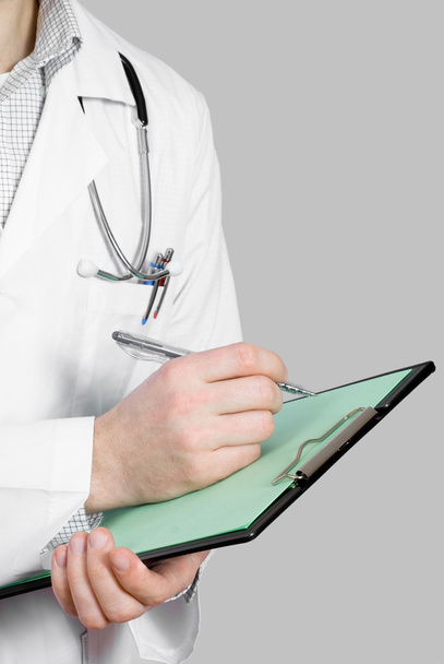 orvos sztetoszkóppal és írótáblával - Fotó, kép