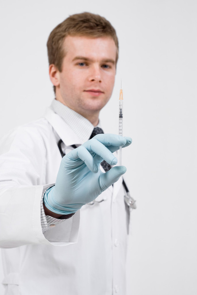 Professional doctor with medical syringe in hands - Photo, image